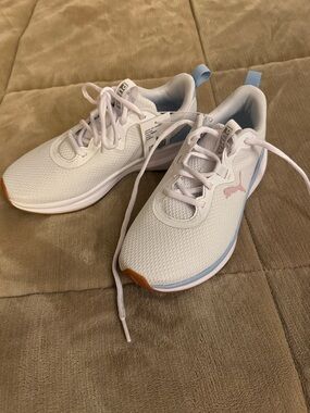 Puma White Sneakers with Light Blue Trim and Pink Logo